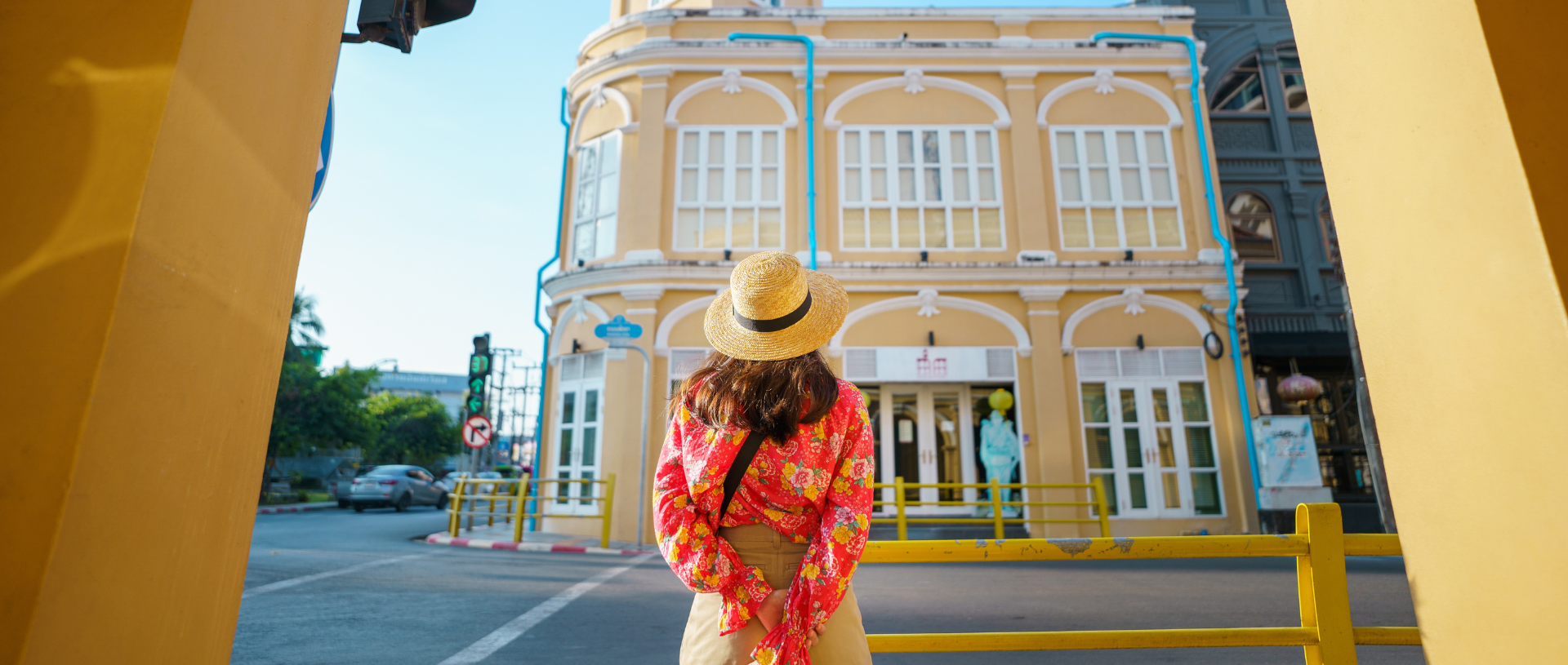 woman-wearing-hat-looking-at-building